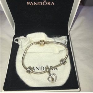 Pandora silver charm bracelet with gold clasp
